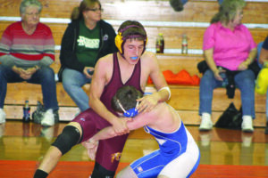 Cherokee's Jaron Bradley (left) works for a dominant position against Isiah Cordell, Hiwassee Dam.  Bradley pinned Cordell  at the 1:06 mark.  