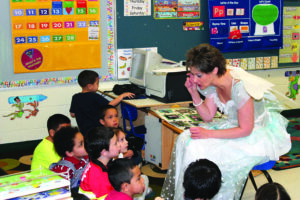 Mellie Burns (also known as the Tooth Fairy), program manager Children’s Dental, is shown presenting classroom education at Dora Reed Childcare Center.  (EBCI Health & Medical photo) 