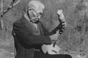 A new book by Anna Fariello of Western Carolina University’s Hunter Library examines Cherokee carving. Here, the late Will West Long, an acknowledged authority on Cherokee cultural traditions as well as a renowned mask maker, uses a mallet and chisel to rough out the form of a mask. (Photo courtesy of the Museum of the Cherokee Indian)