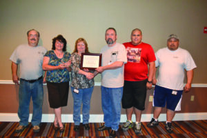 The Eastern Band of Cherokee Indians took first place in the Tribal Utility Summit 3rd Annual Drinking Water Contest.  Shown (left-right) are USET technical assistance specialist Scott Williams; Sally Brady, EBCI Water Treatment Plant lab coordinator; Sheila Hyatt, EBCI Water Treat Plant manager; USET Certification Board chairman Michael Bolt; EBCI Water Treatment Plant lead operator Two-Leaf Sluder; and EBCI Water Treatment Plant maintenance Isaac Long. (USET photo) 
