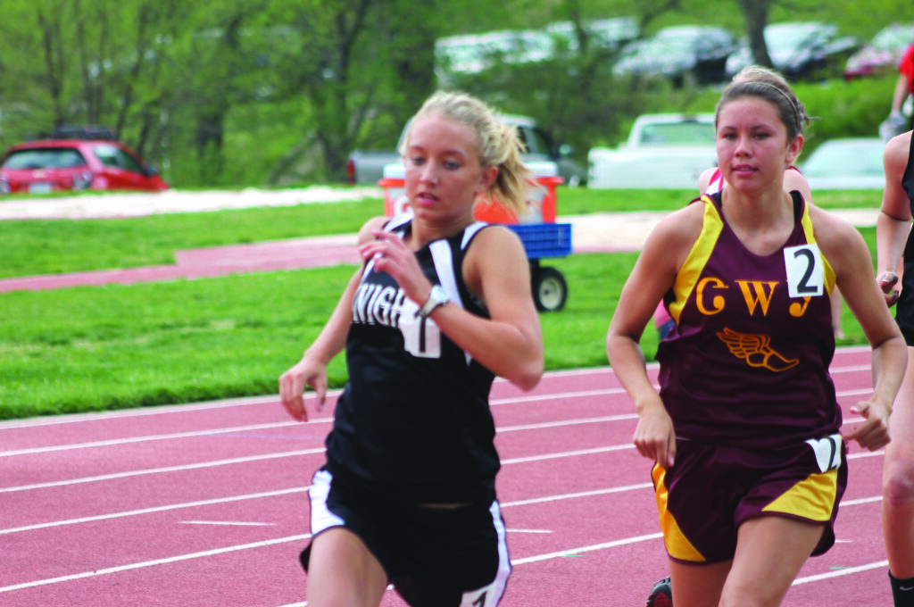 Kendall Toineeta (right), Cherokee, pushes the pace in the women’s 800M run.  With a time of 2:31.88, she took second place behind Shawnda Martin (left), of Robbinsville, who had a time of 2:28.24 