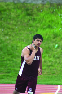 Swain’s Greg Tisho, an EBCI tribal member, gets ready to compete in the men’s shot put.  He took first place with a throw of 43-11.  