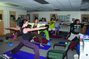 Robin Callahan (foreground left), RD, LDN, MHS, of Cherokee Choices, leads a yoga session at the annual Fitness Frenzy held at the Ginger Lynn Welch Complex on Wednesday, May 22.  (Photo courtesy of Robin Callahan) 