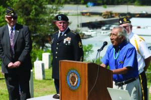 EBCI Beloved Man and WWII veteran Jerry Wolfe (at podium) speaks during Monday’s event.  Shown (left-right) in back are Post 143 Commander Lew Harding, Post 143 service officer Warren Dupree and Legionnaire Sam Lambert.  
