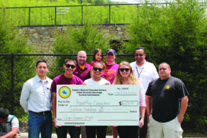 The Tribal Alcoholic Beverage Control Commission gave Healthy Cherokee a check for $1,600 to help with their Prom Promise activities at Cherokee High School.  Shown (left-right) back row – CHS assistant principal Craig Barker, School Board member John “Dick” Crowe holding Livi Crowe, Superintendent Walt Swan; front row – Manuel Hernandez, Healthy Cherokee; CHS students Darius Thompson, Deija Burgess and Alexis Maney; and CPD officer Jason Owle.  
