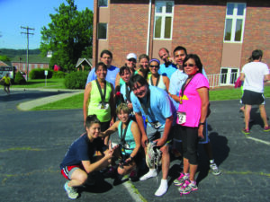Members of the Cherokee Runners participated in the Downhill at Dawn Half-Marathon on Saturday, June 2 including: (left-right) front row – Priscilla Squirrell, Robin Swimmer, Stephan Swimmer, Elnora Thompson; middle row – Deb Bradley, Angel Squirrell, Aaron Swimmer; and back row – Nick Squirrell, Alicia Jacobs, Samantha Ferguson and Michael Henson.  (Not pictured – Charlie Myers and Jimmy Oocumma). (Photo courtesy of Jimmy Myers) 