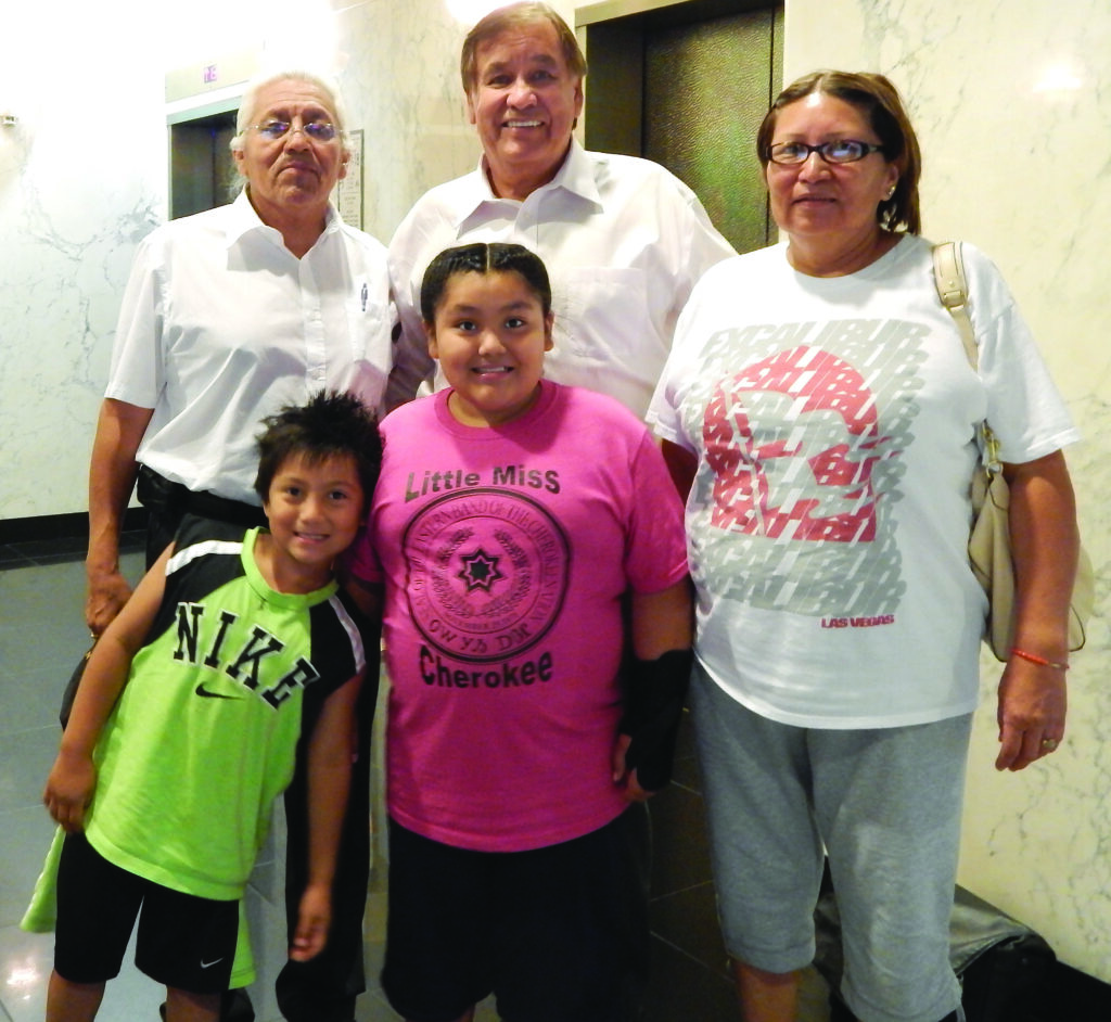 Little Miss Cherokee and her family meet with Billy Mills, 1960 Olympic Gold medalist and member of the Oglala Sioux Tribe.  Shown (left-right) back row - Joe Garcia, Mills; front row - Emiliano Garcia, Little Miss Cherokee Marcela Garcia, and Oneva Garcia. 