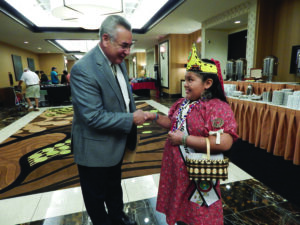 Little Miss Cherokee meets with NCAI president Jefferson Keel (right). 