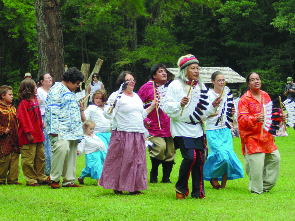 EBCI tribal members Alva Crowe (front left) and Jamie Pheasant lead a traditional Cherokee dance at the 175th Trail of Tears Memorial event held at Red Clay Park in Tennessee on Aug. 3-4.  Events included traditional dancing, storytelling by Freeman Owle, an exhibition stickball game by Wolftown, flute music by Eddie Bushyhead, Cherokee artists vendors, exhibits and more.  (Photo by Arizona Jane Blankenship) 