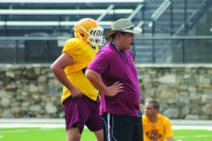 Coach Smith oversees a special teams drill during Monday's practice. 