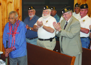 Members of the Steve Youngdeer American Legion Post 143 give Wolfe a standing ovation after he was awarded the Patriot Award on Wednesday.  