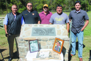 The Clarence “Ting” Rogers Memorial Ballpark was dedicated in the Birdtown Community on Thursday, Oct. 10.  Shown (left-right) at the memorial plaque are Principal Chief Michell Hicks, Birdtown Rep. Tunney Crowe, Big Cove Rep. Perry Shell, Yellowhill Rep. David Wolfe, and Birdtown Rep. Albert Rose. (SCOTT MCKIE B.P./One Feather photos) 