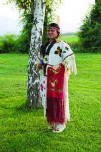 Crowe is shown in her traditional Yakama dress. 