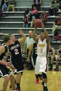 Cherokee’s Jesse Toineeta (#21) goes for a shot around two Andrews defenders. 