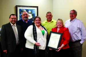 Lana Lambert (2nd from left front row) was named the 2013 Frell Owl Award Winner during a luncheon last month.  Lambert works at VOC and serves as the coordinator for the Qualla Boundary Special Olympics program.  Shown (left-right) front row – Tommy Lambert, Boys Club general manager; Lana Lambert; back row – Big Cove Rep. Perry Shell, Principal Chief Michell Hicks and Boys Club president Wilbur Paul.   (CBC photo) 