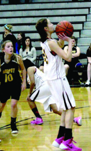 Cherokee Middle School’s Tori Teesateskie pulls up for a shot during a game against Murphy in the first round of the SMC tournament on Saturday, Jan. 25.  She led the Lady Braves with 20pts in their big 74-19 win.  (AMBLE SMOKER/One Feather)