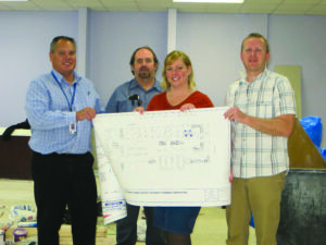 Checking out the plans for the Pharmacy expansion are (left-right) Dwayne Reed, CIH director of engineering; Willie Lambert, CIH facilities manager; Elizabeth Helm, CIH chief pharmacist; and Jason White, CIH deputy chief pharmacist.  (CIH photo)