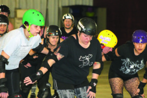 The Smoky Mountain Roller Girls practice at the Swain County Recreation Center on Sunday, Jan. 26.  (SCOTT MCKIE B.P./One Feather photos) 