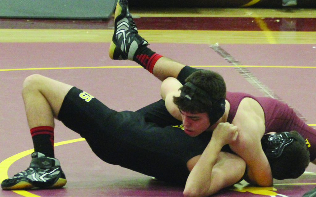 Cherokee’s Levi Swearengin squares off against Hayesville’s Jeffrey Waldroup during a match at home on Thursday, Jan. 16.  Swearengin pinned Waldroup in 13 seconds.   (AMBLE SMOKER/One Feather)