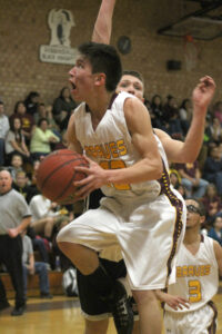 Dustin Johnson (#22) goes inside for a lay-up in the first period of Thursday's semi-final game against Murphy.  
