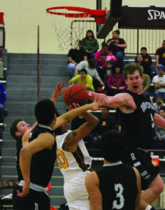 Darius Thompson (#20) shoots through several Robbinsville’s defenders including Brett Crowe (#20) and Jesse Franks (#5). 