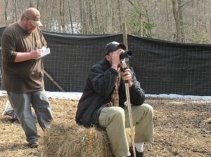 Environmental specialist Dallas Bradley (left) and supervisory biologist, Dr. Caleb Hickman (right), of the Eastern Band of Cherokee Indians Fisheries and Wildlife Management Department, observe a herd of 38 white tail deer that are being reintroduced into the wild by the Tribe on Monday. (Photo credit: Eastern Band of Cherokee Indians)