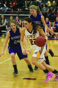 Avery Mintz (#22) drives past Mitchell’s Jacque Wiseman (#24).  Mintz led Cherokee with 23pts on the night. 