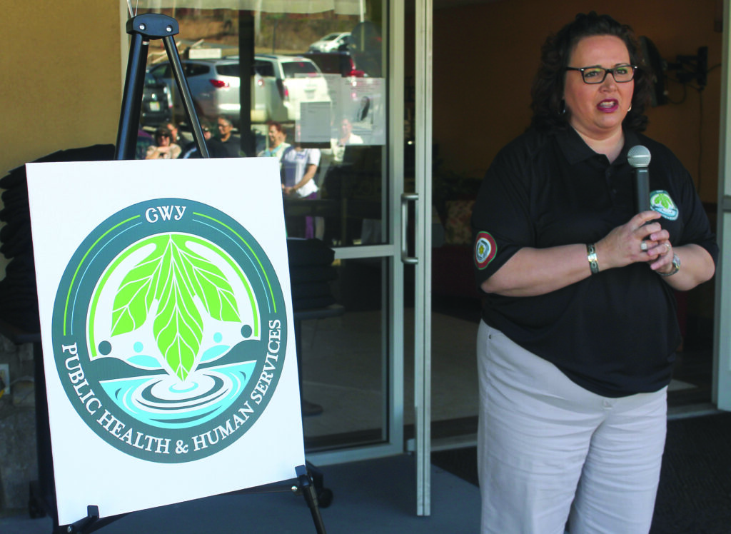 Vickie Bradley, EBCI Deputy Housing Officer, explains the logo of the new Cherokee Public Health and Human Service Division during an event launching the new division on Tuesday, Feb. 18.  (SCOTT MCKIE B.P./One Feather photos) 