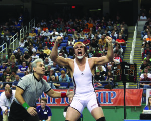 Spencer McCoy, an EBCI tribal member from Swain, celebrates his second consecutive state title moments after he pinned Avery County’s Ryan Sheppard.  