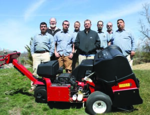 The Sequoyah National Grounds Staff is shown (left-right) with the Aerating equipment: Marco Torres, Don Stewart, Billy Rhinehart – environment technician, Niall Connell – irrigation technician, Joel Krause – superintendent, Frankie Jenkins – assistant mechanic, Joseph Cooper, and Leon Sampson.  Not pictured:  Jason Walker- head mechanic and Mick Foulweather – assistant superintendent.  (Photo courtesy of Jody Bradley) 