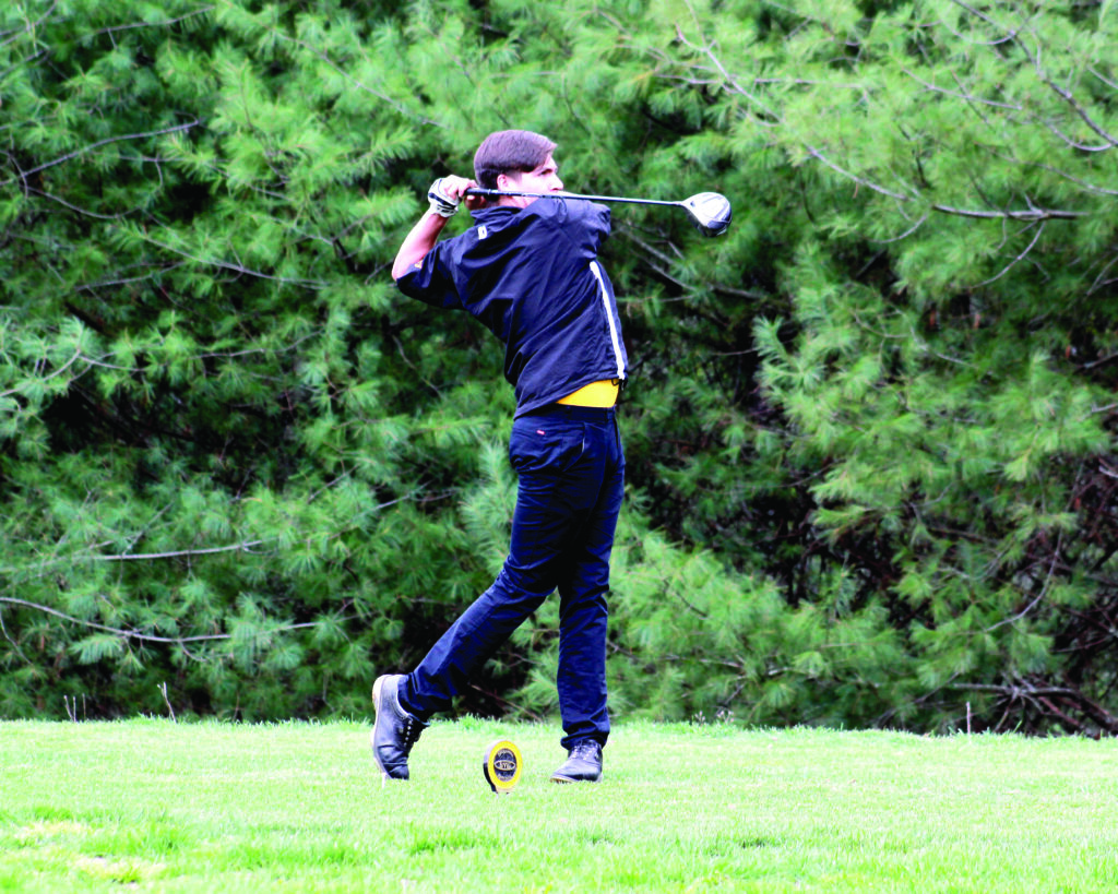 Cherokee’s Tagan Crowe follows through on a drive during a home match at the Sequoyah National Golf Club on Tuesday, April 8.  He took first place overall with a score of 41.   (AMBLE SMOKER/One Feather) 