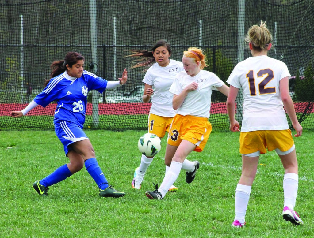 Cherokee’s Andrea Cedillo (#3) challenges Highlands’ Sarah Torres for the ball during Tuesday's home game.  (SCOTT MCKIE B.P./One Feather) 