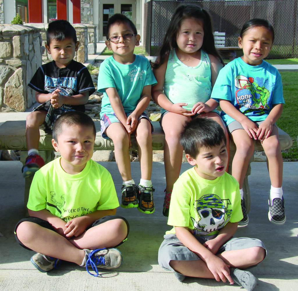 The following students at the Dora Reed Center achieved membership in the 50-100 Book Club: front row (left-right)  – Calvin Taylor, Caius Littlejohn; back row – Elijah Youngdeer, Jeremiah Locust III, Zailiana Blythe, and Nashoba Tushka.  (SCOTT MCKIE B.P./One Feather) 