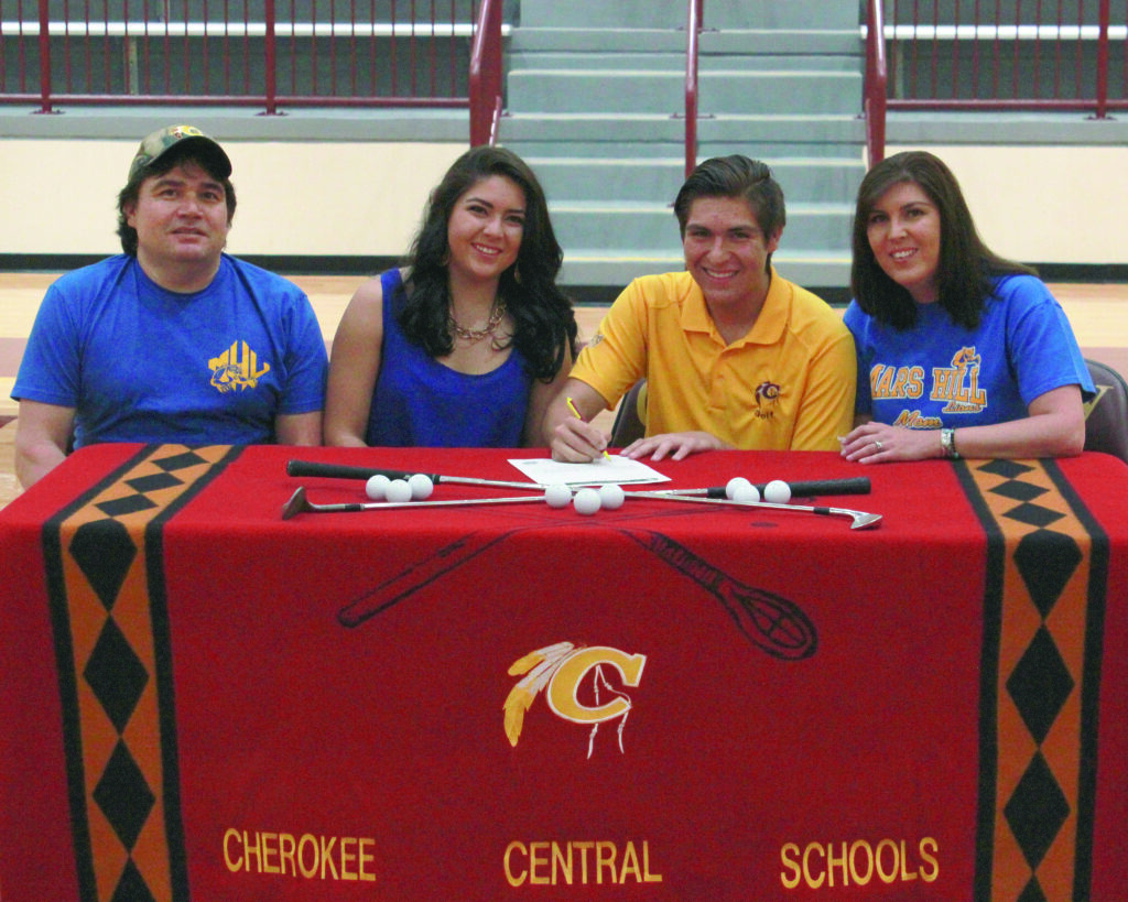 Tagan Crowe (2nd from right) signs a letter of intent on Thursday, May 22 to play golf next season at Mars Hill University.  He is shown (left-right) with his father, Peanut Crowe, sister, Madison Crowe, and mother, Radonna Crowe (right).   (AMBLE SMOKER/One Feather) 