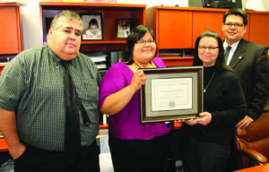 The Risk Management Division poses with the Fiscal Recognition Certificate they received in the 2012-13 SOAR Awards.  Shown (left-right) are Joe Bernhisel, workplace safety officer; Agnes Reed, claims administrator; Barbara Owle, Risk manager; and Cory Blankenship, tribal treasurer.  