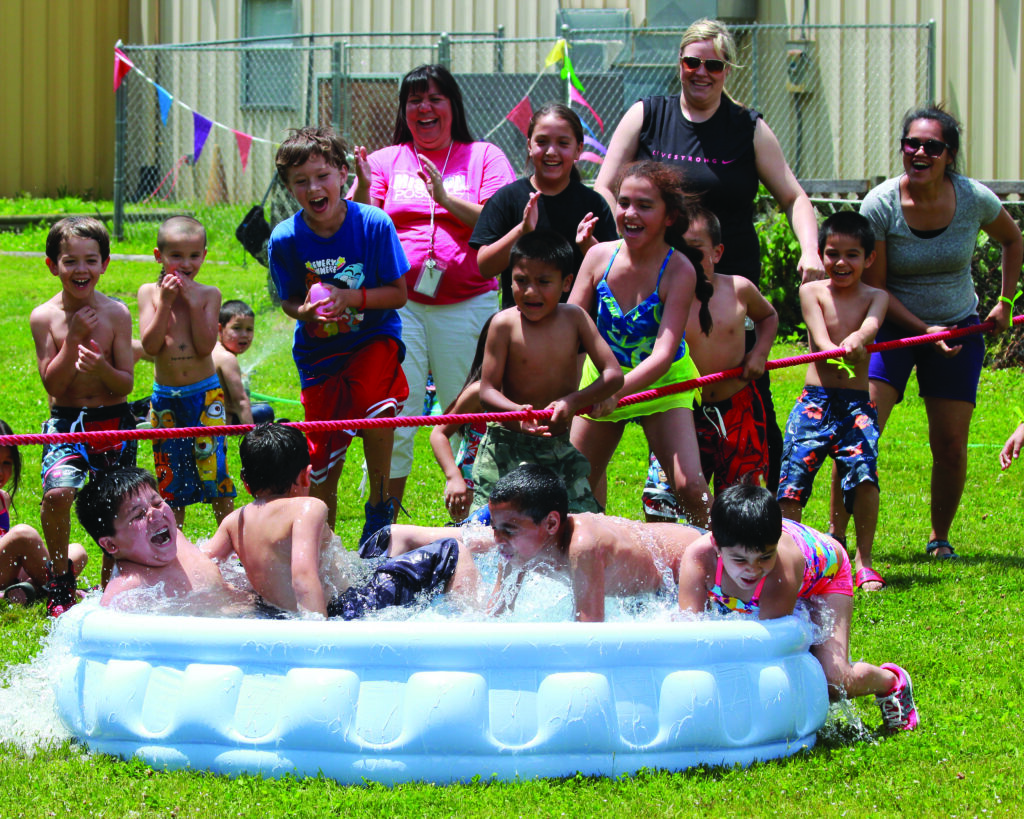 Students at the New Kituwah Academy enjoy the pool during their 3rd Annual Field Day held at the Cherokee Youth Center on Tuesday, May 20.  (AMBLE SMOKER/One Feather) 