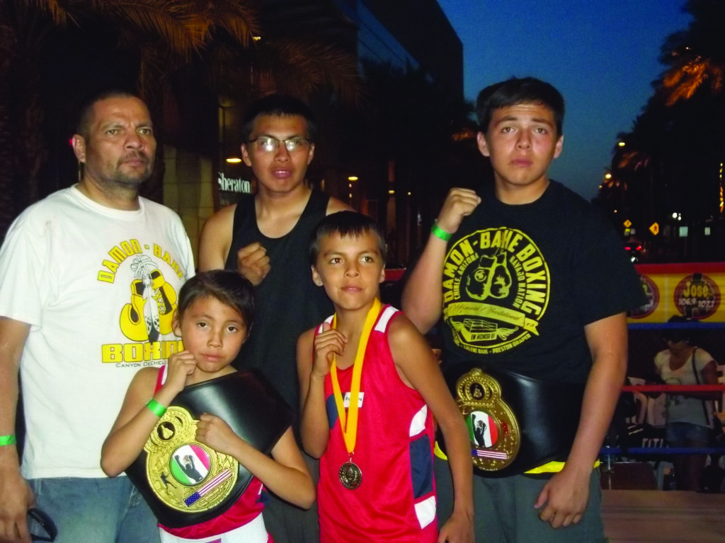 The Bahe boxing family is shown (left-right) back row – coach and father John Bahe, Jeremiah Bahe, and Joshua Bahe; front row – Mairah Bahe and James Bahe.  (Photos courtesy of Bahe family) 
