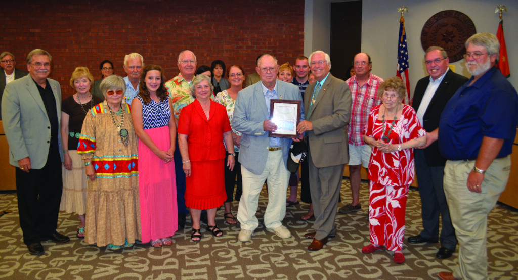 Cherokee Nation veteran Cyrus Gilmore (center), of McMinnville, Tenn., is surrounded by family as he accepts his Cherokee Nation veteran award from Cherokee Nation Principal Chief Bill John Baker, Deputy Chief S. Joe Crittendon and Tribal Council.  (Cherokee Nation photo) 
