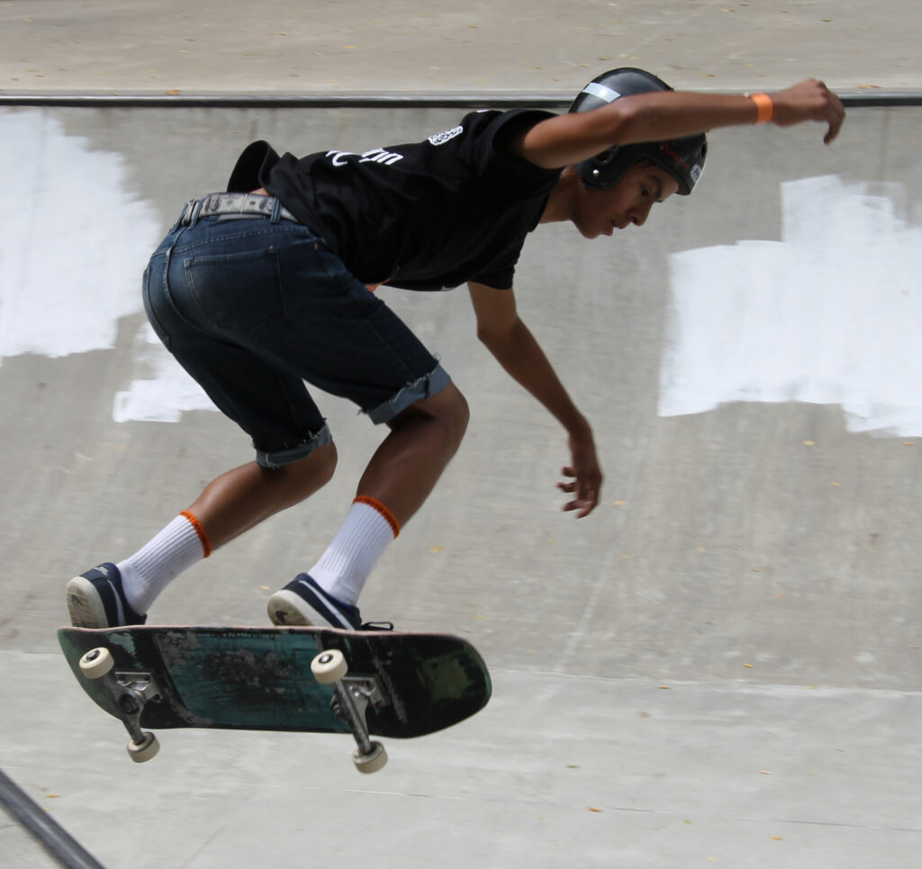 Ira Smart, an EBCI tribal member, flies off of the bowl during the intermediate division competition, in which he took second place, at the Cherokee Skate Jam held at the Cherokee Skate Park on Saturday, June 28. (SCOTT MCKIE B.P./One Feather) 