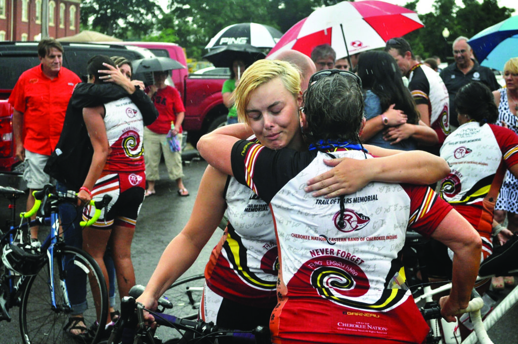 Remember the Removal bike riders Elizabeth Burns, Cherokee Nation, and Patricia Watkins, EBCI tribal member, embrace each other after completing the 950-mile journey to Tahlequah.   (Cherokee Nation photos) 