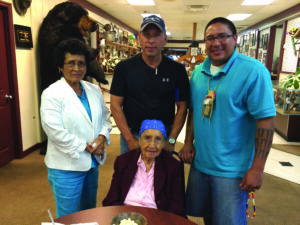 EBCI tribal elder and fluent Cherokee speaker Amanda Swimmer (seated) is shown with Nancy Fields, L.S. Fields and her grandson Micah Swimmer at Wednesday's Consortium.  Nancy and L.S. are Cherokee speakers from Oklahoma.  