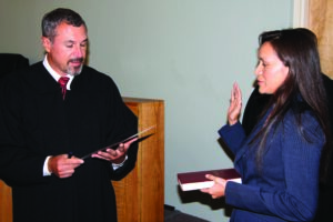 Leslie Shannon Swimmer (right)  is sworn-in as the new Clerk of Court for the Cherokee Tribal Court by Cherokee Chief Justice Bill Boyum on Monday, July 28.  (SCOTT MCKIE B.P./One Feather) 