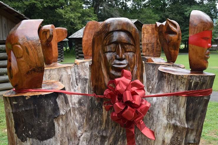 The Seven Clans masks carving at Red Clay State Historic Park (Tenn.) was dedicated with a ribbon cutting ceremony on Thursday, July 31.  (Photo courtesy of Howard Pierce/Cleveland Daily Banner) 