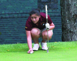Peri Wildcatt lines up a putt during a match at Highlands on Tuesday, Sept. 9.  She led the field on the day with a score of 56.  (AMBLE SMOKER/One Feather) 