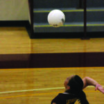 Macie Welch (#5), Lady Braves setter, serves one during Tuesday’s match.   