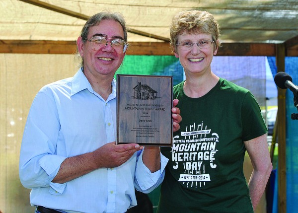 EBCI tribal member Davy Arch receives the 2014 Mountain Heritage Award from WCU Provost Alison Morrison-Shetlar at Mountain Heritage Day on Saturday, Sept. 27 at the festival grounds’ Blue Ridge Stage on the WCU Campus.  (Photo by W. Keith Brenton/WCU) 