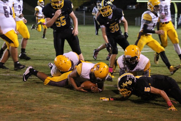 Kennan Panther, the leading tackler in western North Carolina, pounces on a Murphy fumble in the third quarter. 