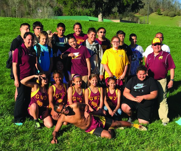 The Cherokee Middle School track teams are shown at a meet at Robbinsville on Monday, March 30.  Shown (left-right) back row – Aniyah Younce, Josh Driver, Darius Lambert, Coach Miranda Stamper, Mykel Lossiah, Blake Smith, Caden Pheasant and Manager Will Poolaw; middle row – Coach Ahli-sha Stephens, Cade Mintz, Makayla Pheasant, Josiah Lossiah, Sterling Santa-Maria, Me-Li Jackson and Coach Eddie Swimmer; and front row – Jalen Albert, Hallam Panther, Deliah Esquivel, Taylin Bowman, Christina Lee and Moira George; and front prone – Isaiah Evans.  (Photo courtesy of Miranda Long Stamper) 