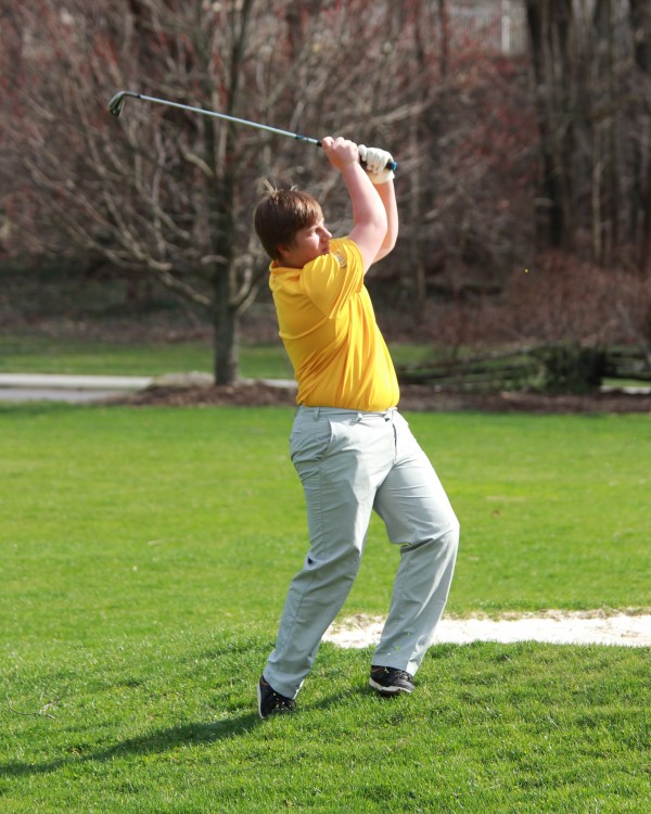 Christian Ensley swings from the fairway in a four-team match at Cummings Cove Golf and Country Club on Tuesday, March 31.  He finished fourth and led the Braves with a score of 42.  (AMBLE SMOKER/One Feather)