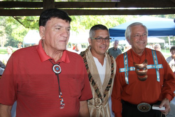 UKB Principal Chief George Wickliffe, EBCI Principal Chief Michell Hicks and Cherokee Nation Principal Chief Bill John Baker are shown after exchanging gifts at the opening of Friday’s Tri-Council meeting. (SCOTT MCKIE B.P./One Feather photos) 